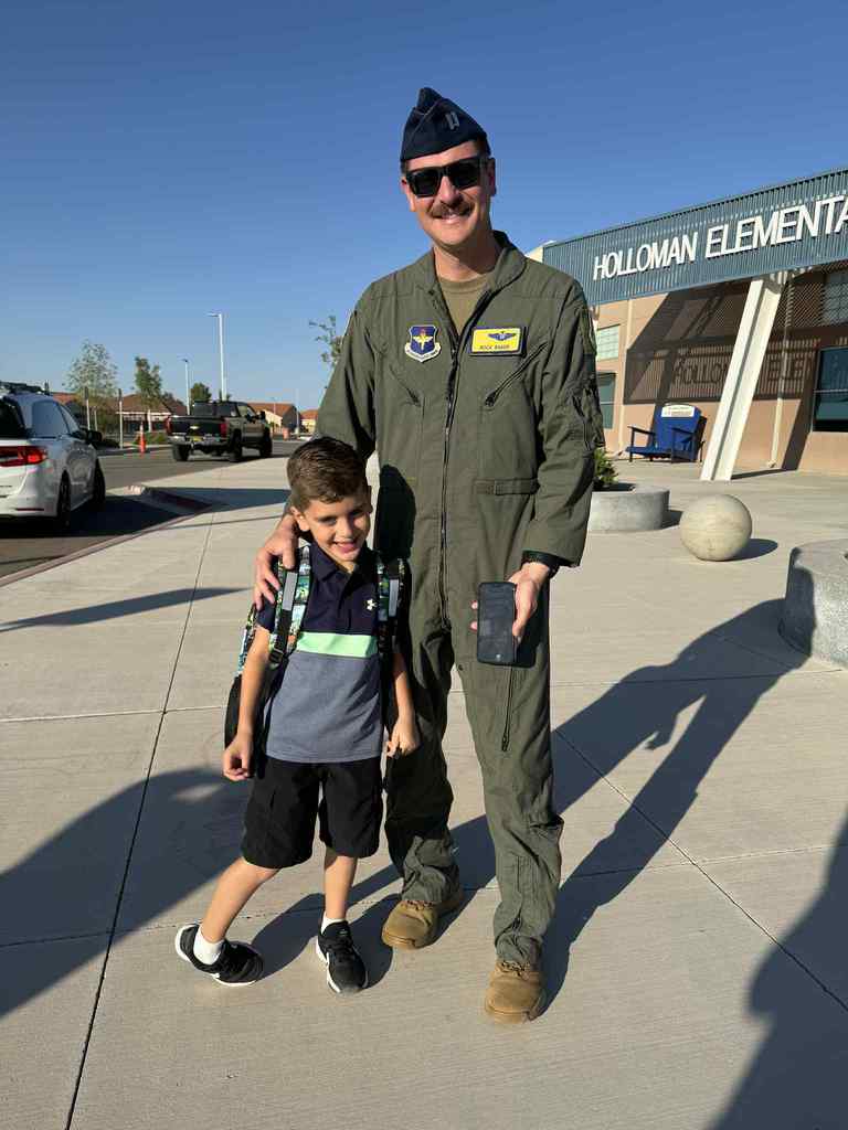 military pilot dropping off their student at school