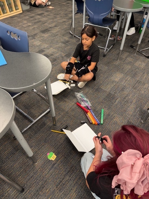 Two students working with blocks