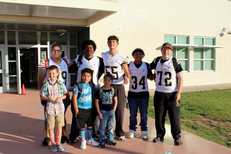 SHE Students with AHS Football team