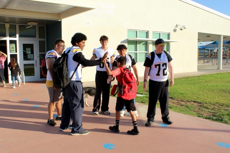 SHE Students with AHS Football team