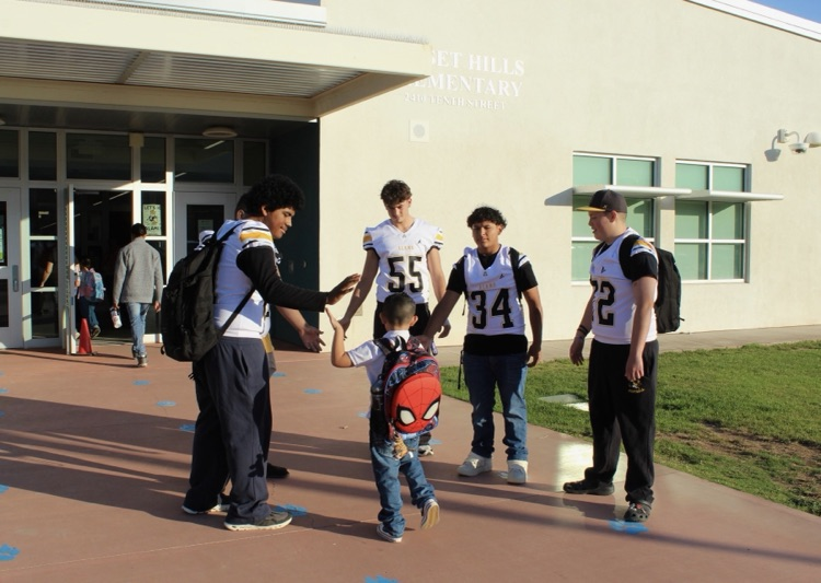 SHE Students with AHS Football team