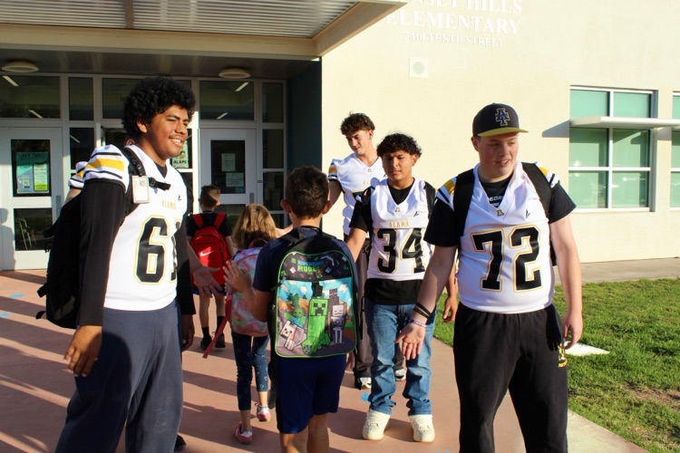 SHE Students with AHS Football team