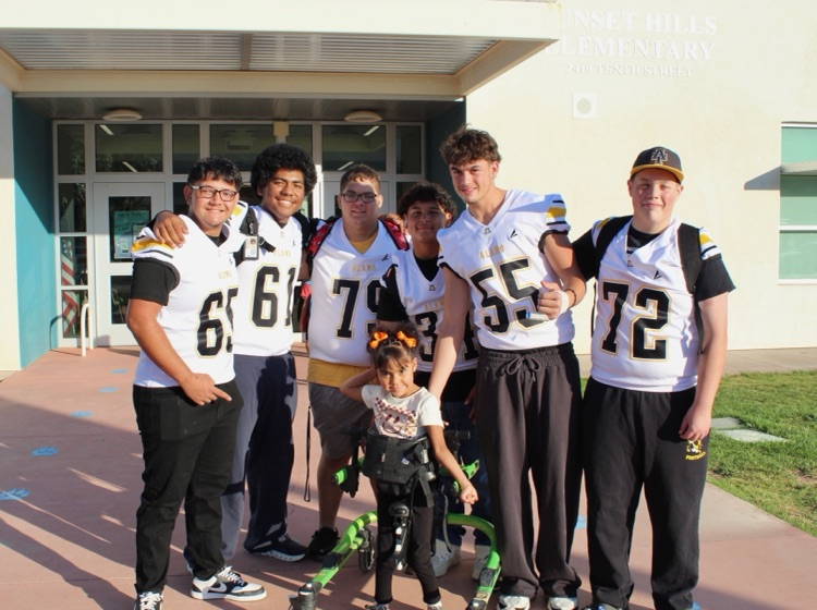 SHE Students with AHS Football team