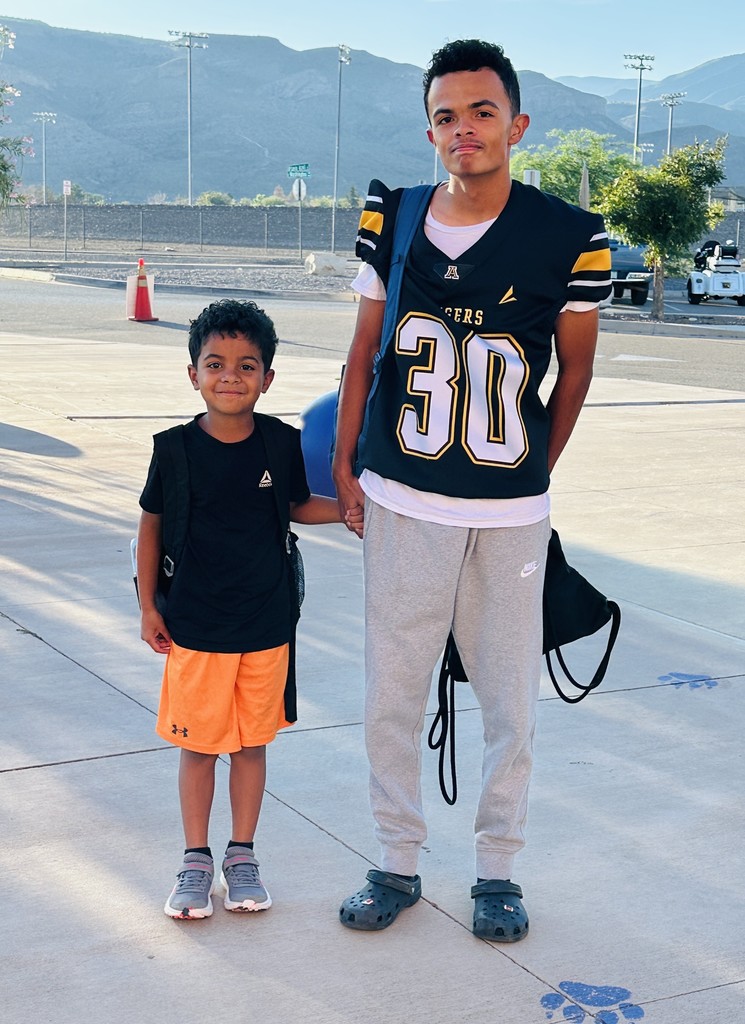 AHS Tigers Football player with his little brother at Desert Star Elementary