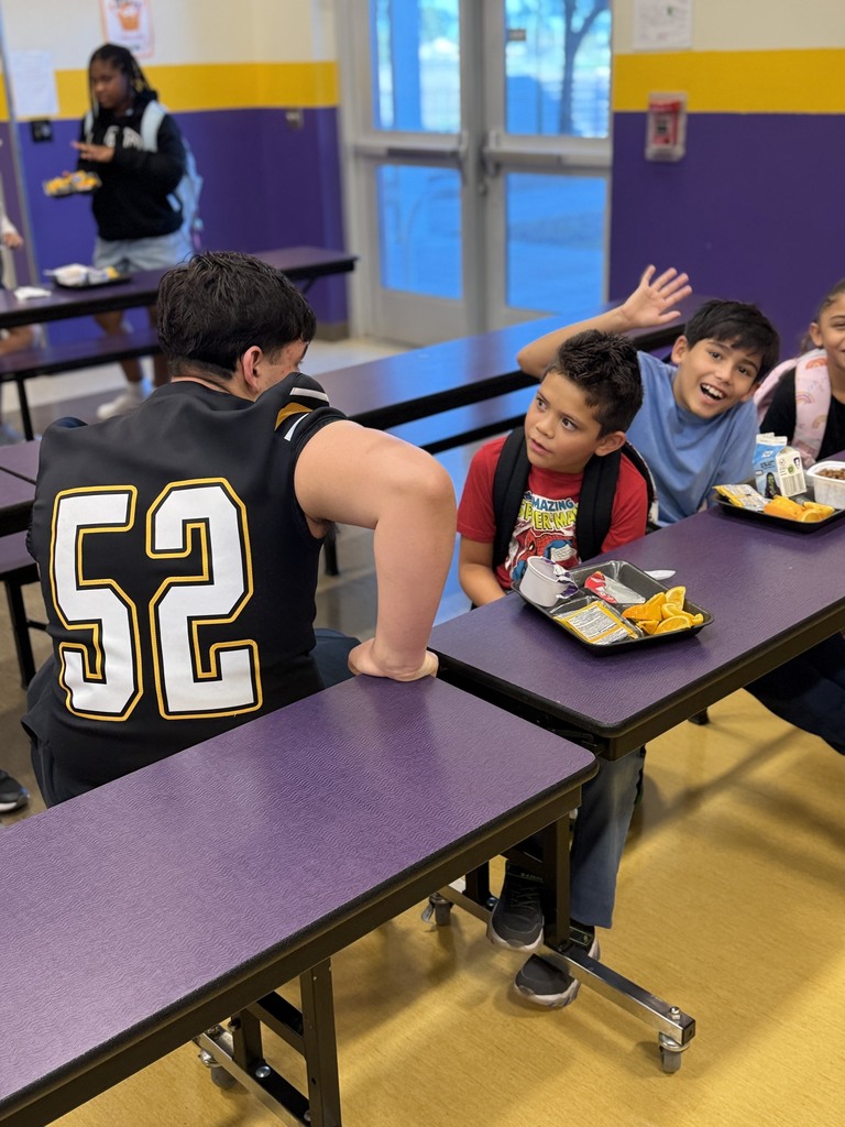 AHS Tigers Football team chatting with Desert Star Elementary Students