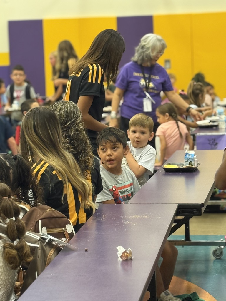 AHS Tigers team chatting with Desert Star Elementary Students