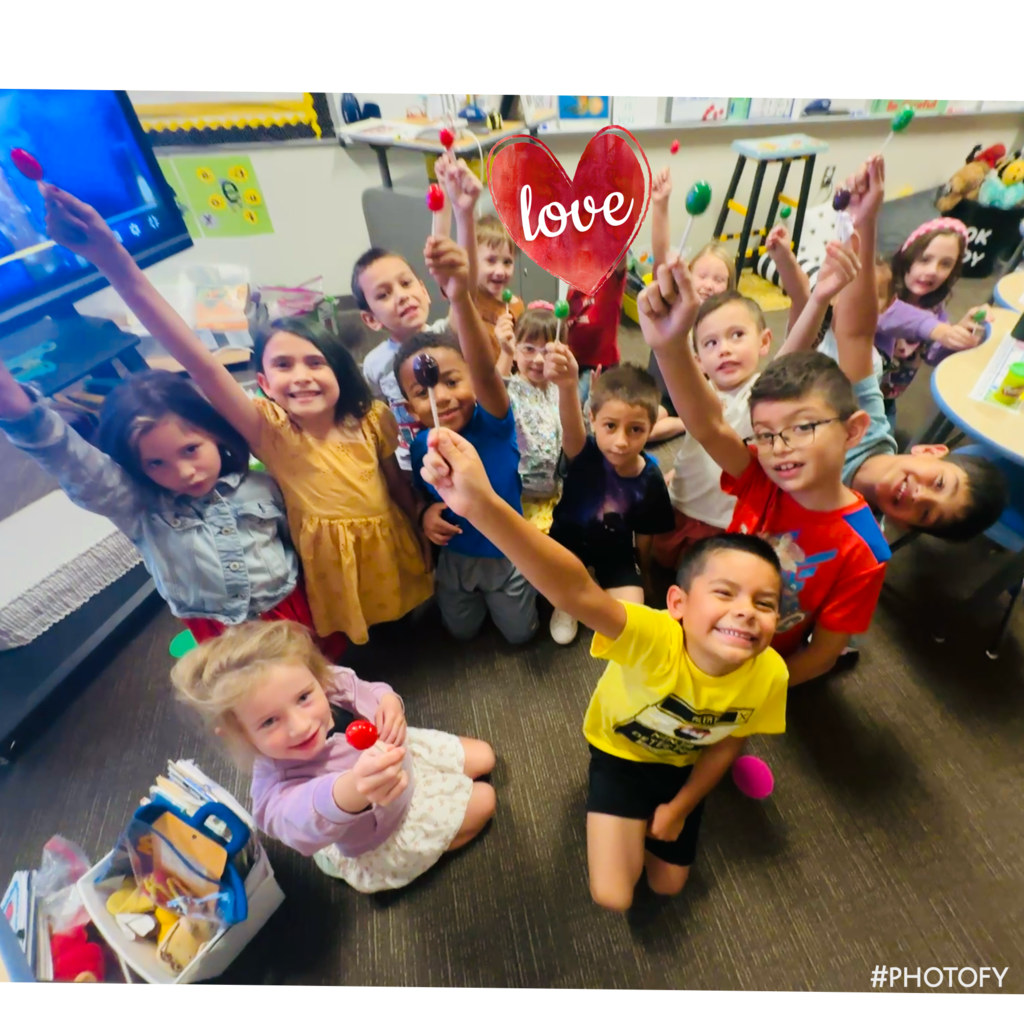 Hands Holding Blow Pops in Mrs. Wolfe's Class