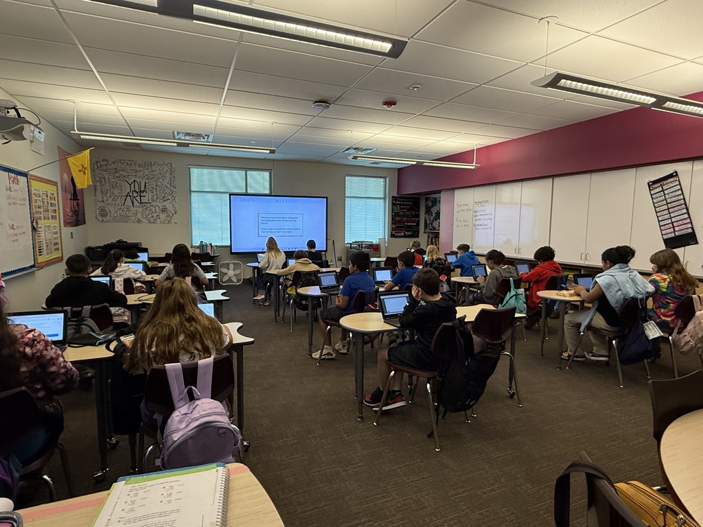 4th grade students learning how to email while answering questions about setting classroom goals.