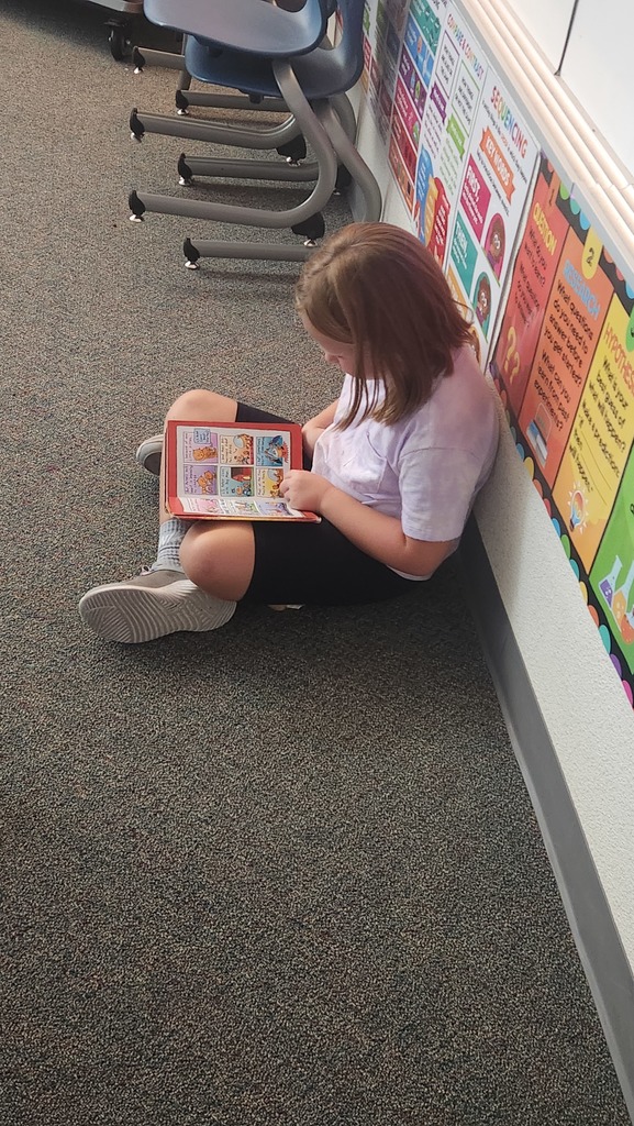 child reading to herself