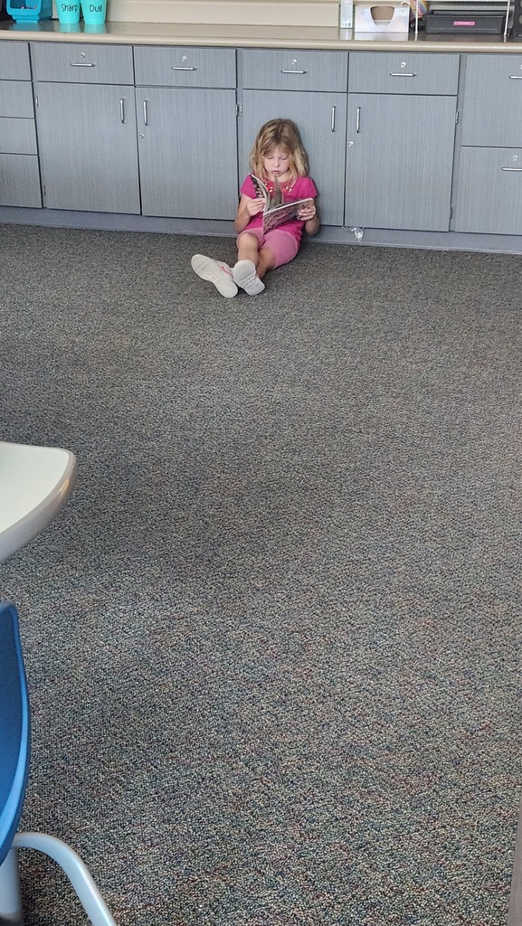 child reading to herself