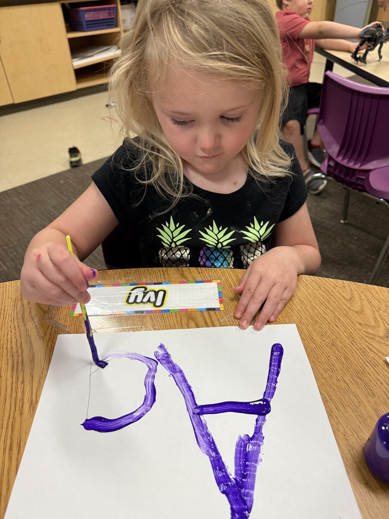 Student learning uppercase and lowercase “A” through painting