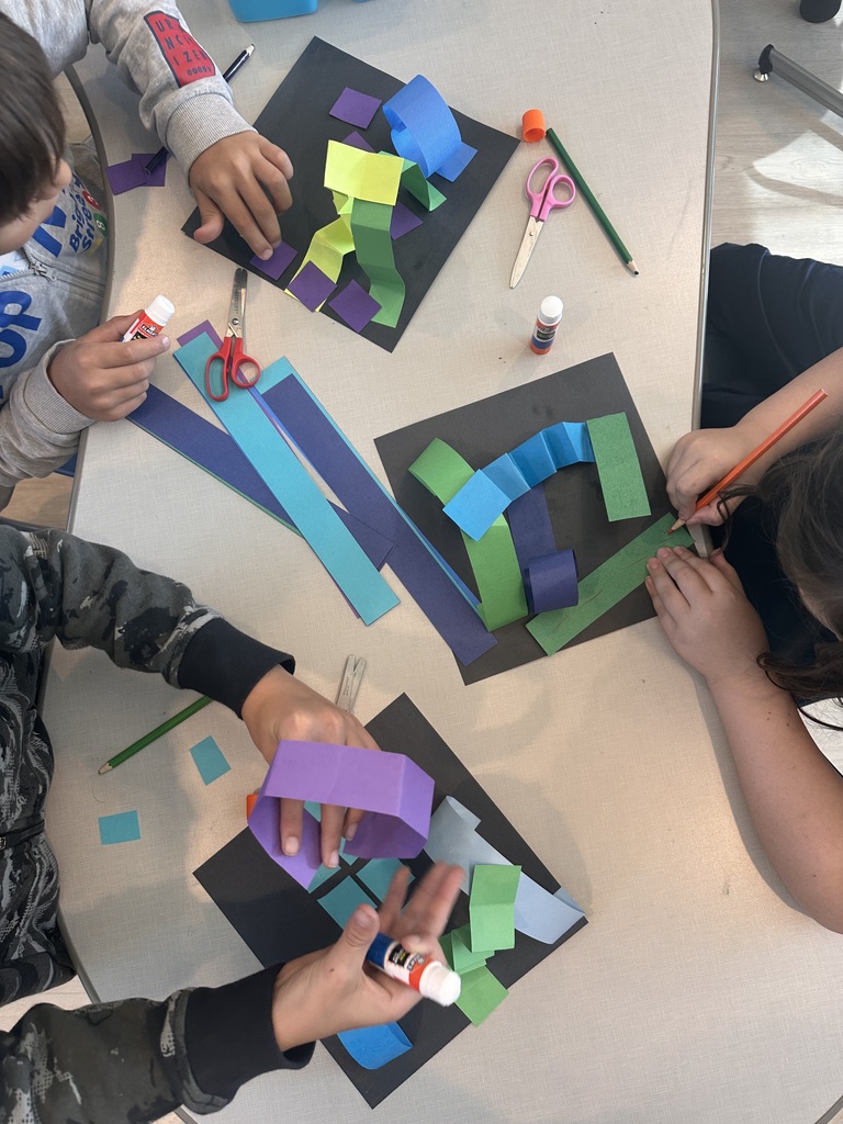 hands of students gathering supplies to beign art creation