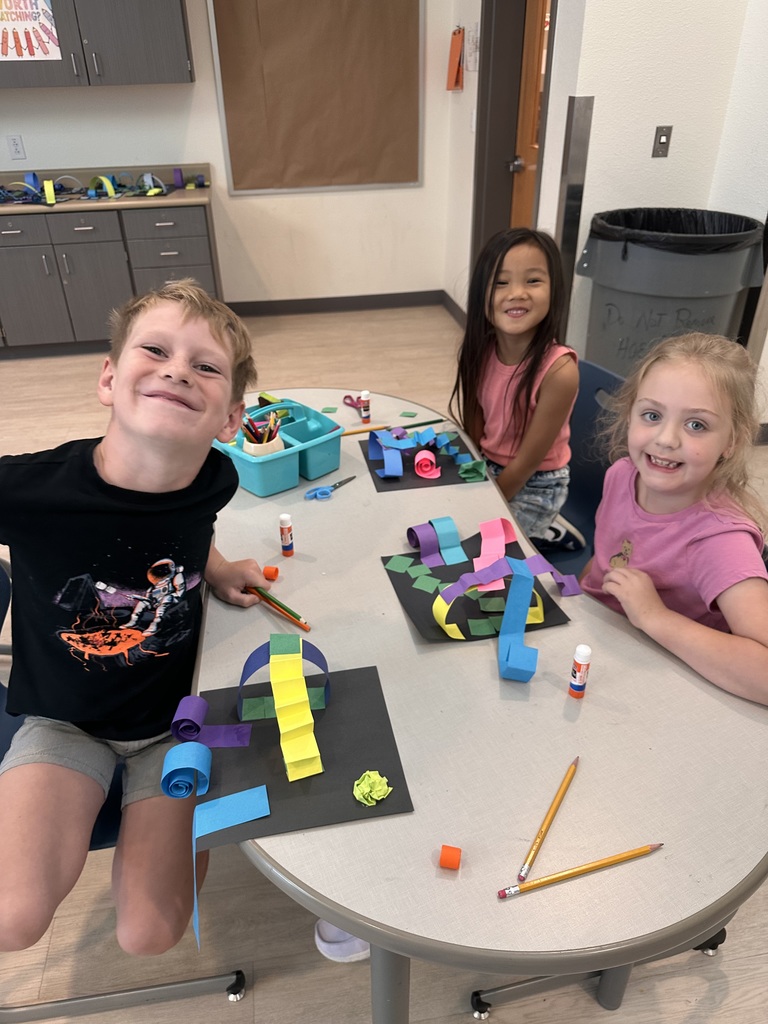 students proud of their art work