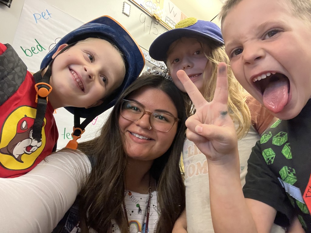 Ms. Bustamante with students on hat day.