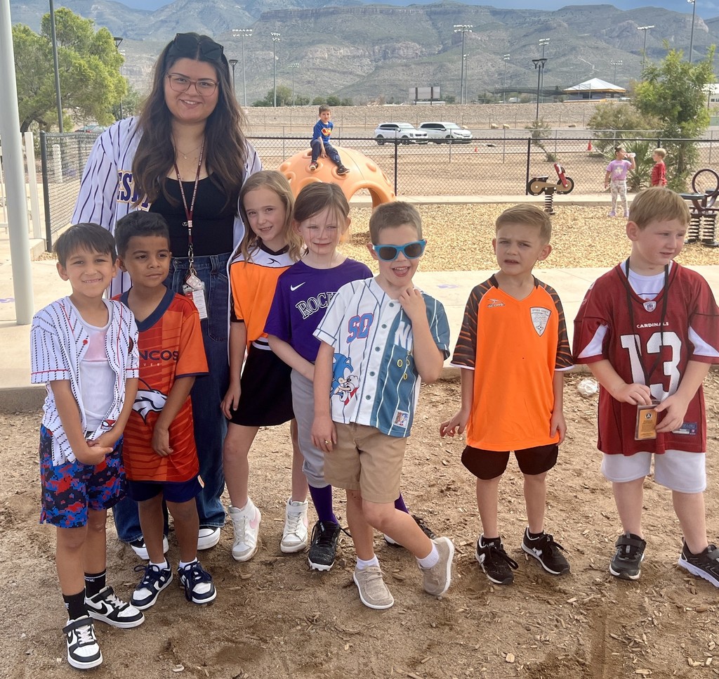 Ms. Bustamante  with her students on jersey day.