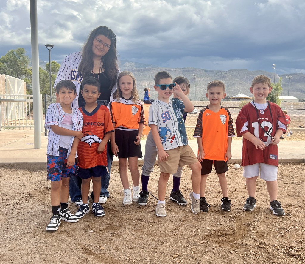 Mrs. Bustamante  with her students on jersey day.