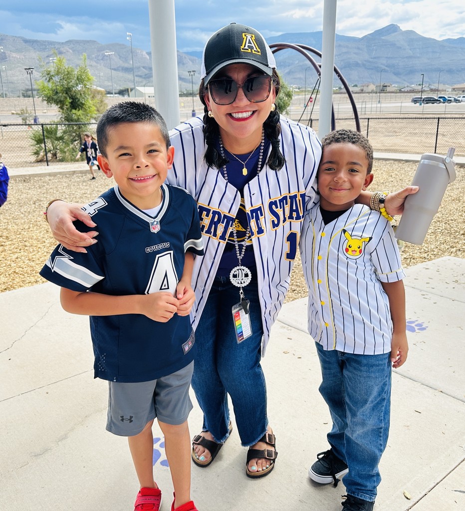Mrs. Wolfe with some of her students on jersey day. 