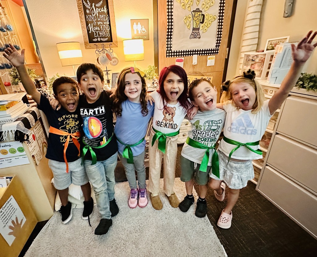 First Graders excited to get their new belts.