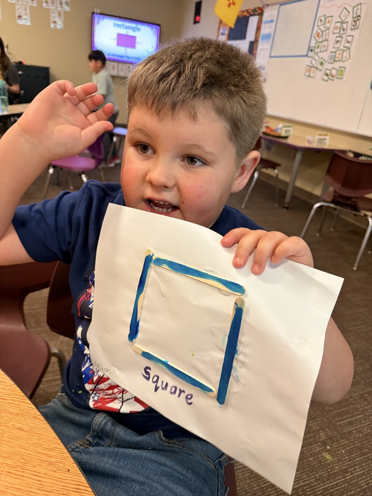 Student showing off his two dimensional shape.