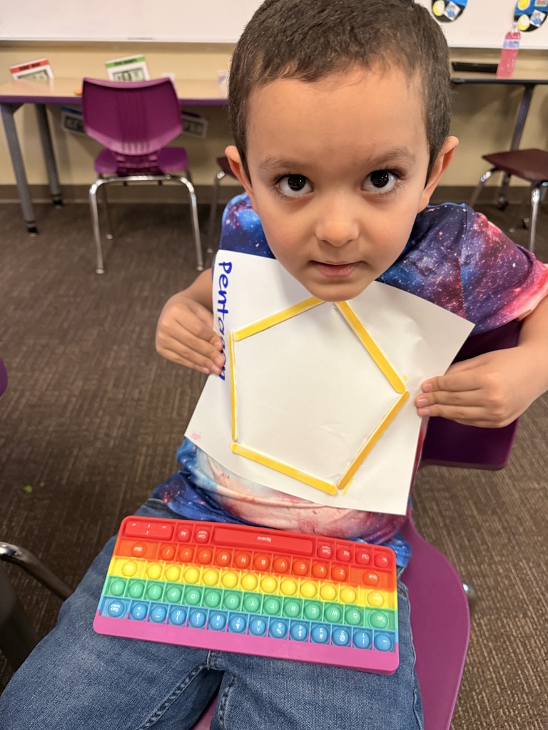 Student showing off his two dimensional shape.