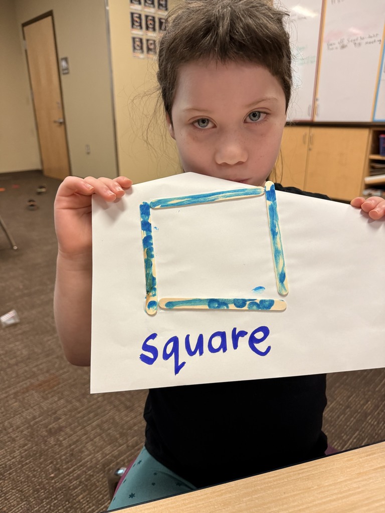 Student showing off her two dimensional shape.