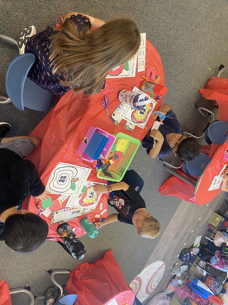 students creating apple crafts