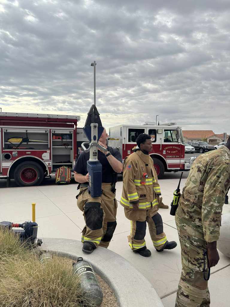firefighter demonstrating another tool for emergency