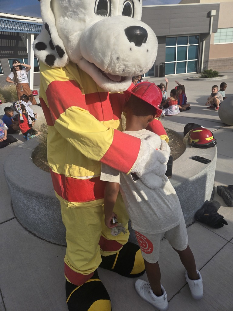 student hugging Sparky