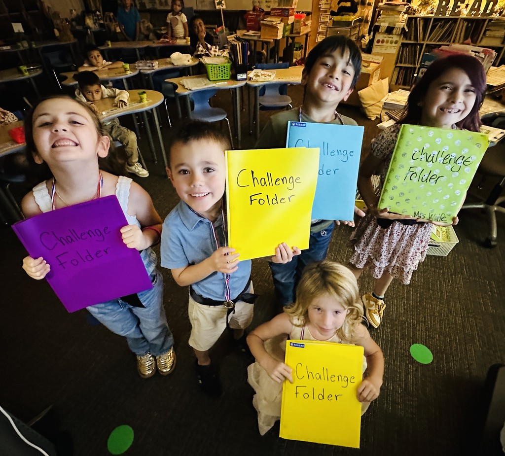 Students showing off their challange folder.