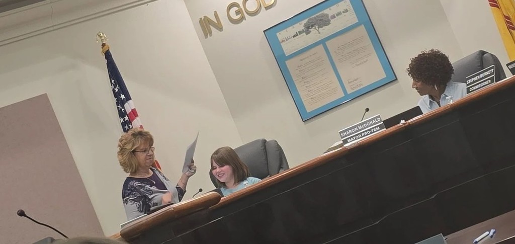 Sunset Hills Elementary student with Alamogordo's Mayor at the commission meeting