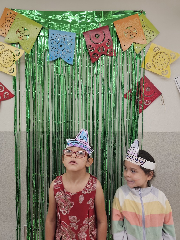 2 girls with decorations and hats