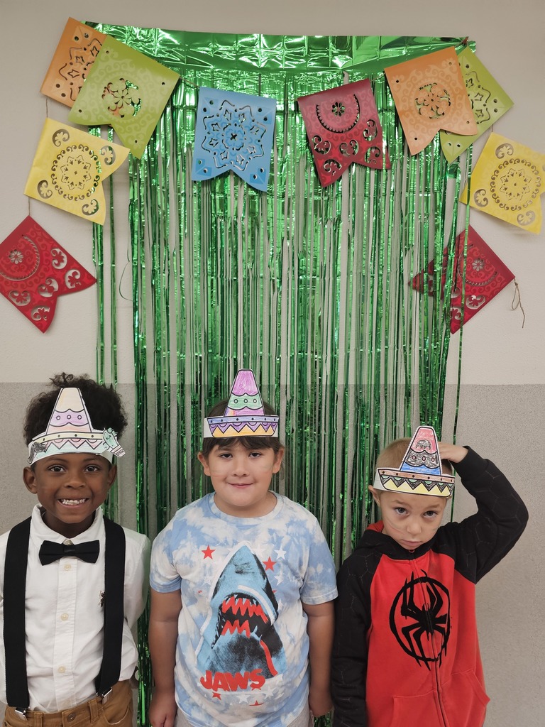 3 students with hats