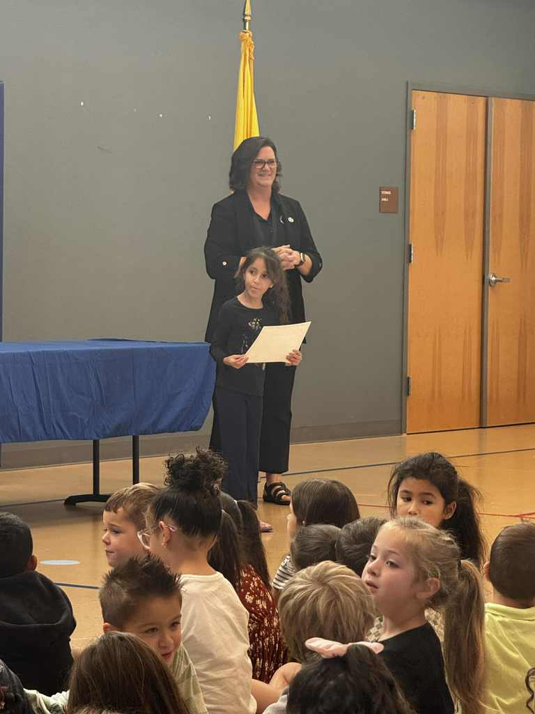 principal and student at awards assembly