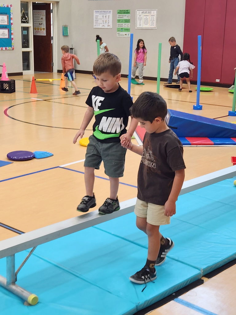 two students working together in PE