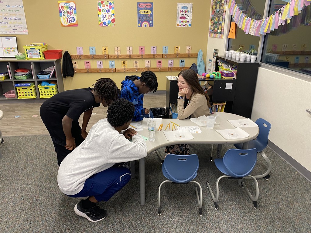 Teacher walking families through STEM activity