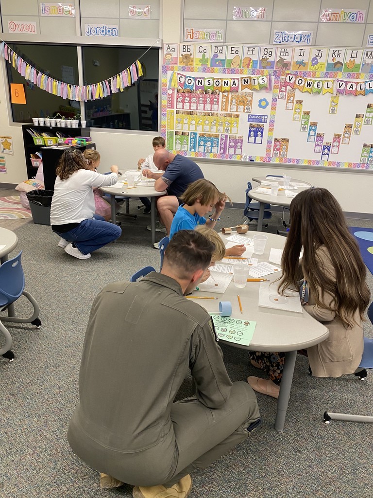 parent and student focused on STEM night activity