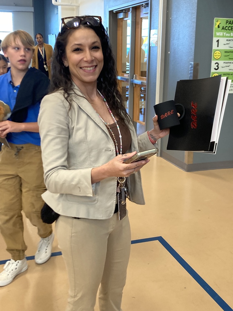 Teacher receiving DARE graduation awards