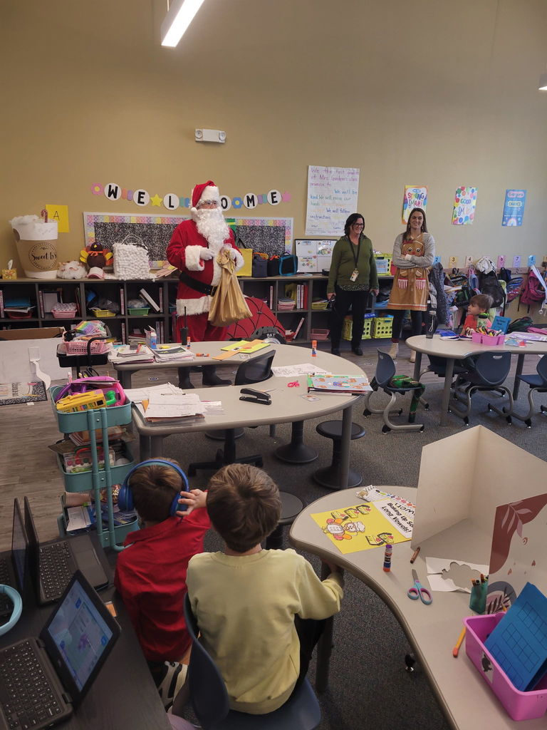 Santa Claus delivering candy canes to class
