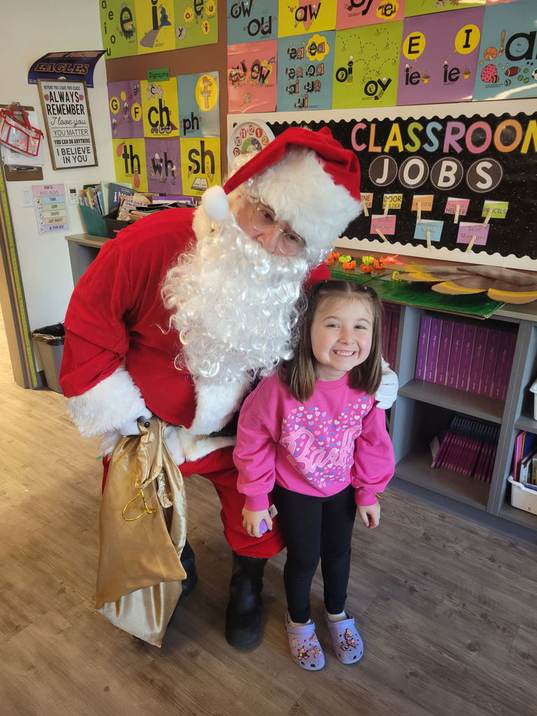 Student hugging Santa