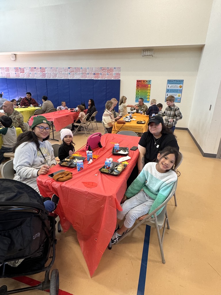 Student sitting at table with parent