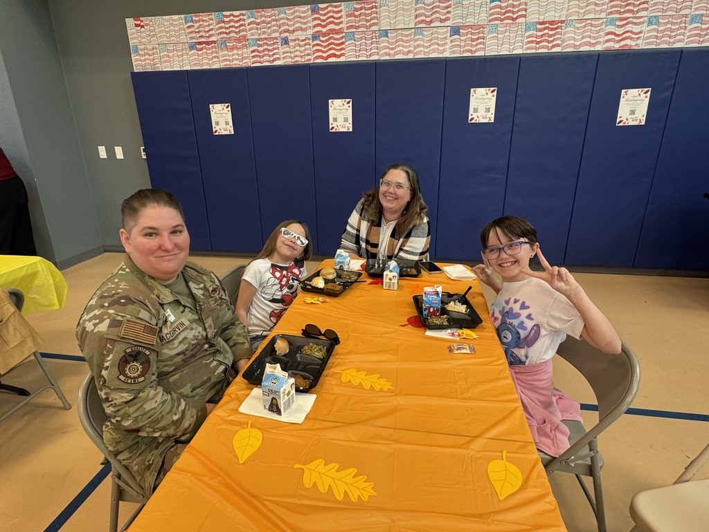 Teacher parent enjoying a meal with their children