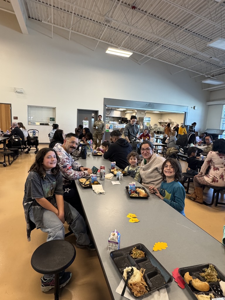 siblings sharing a meal with parents