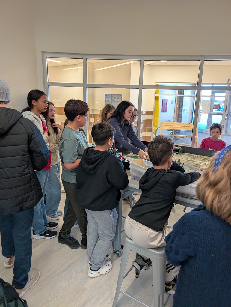 Teacher talking to students about Lego missions