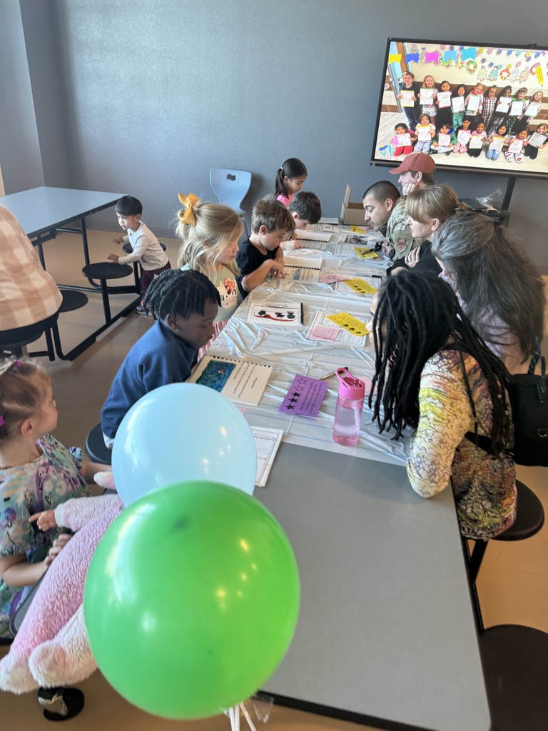 students focused on writing on their personal books