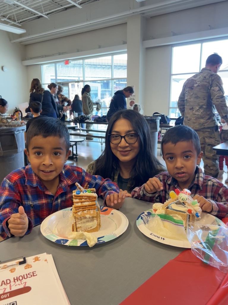 pre k students playing with ginger bread houses