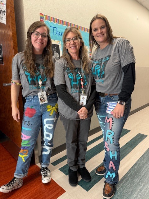 staff wearing school colors