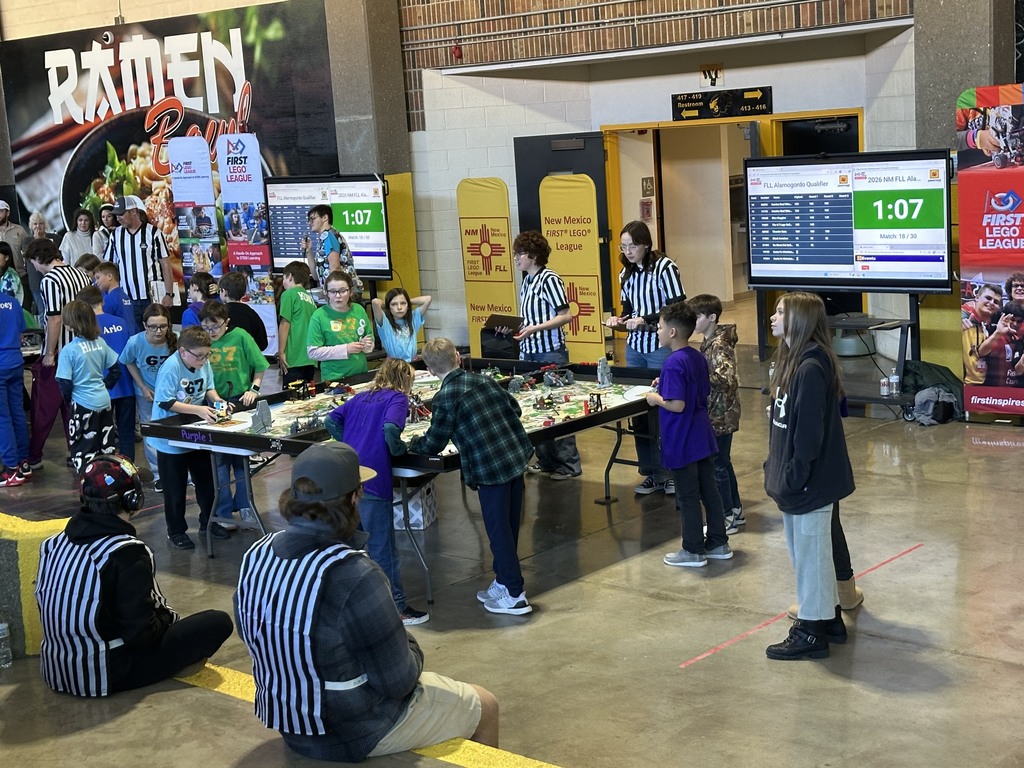 referees and students around lego table