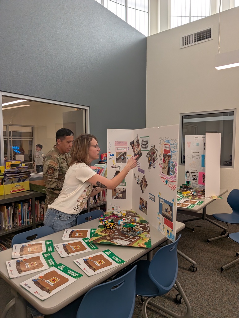 Parents browsing Lego League tables