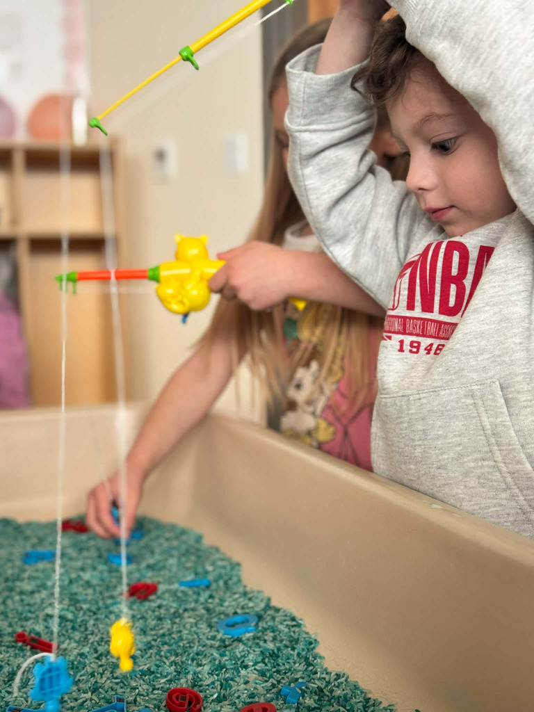 student fishing for letters