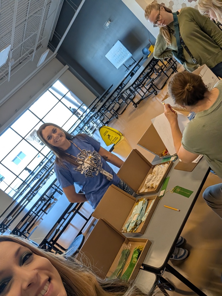 science fair committee discussing ribbon places